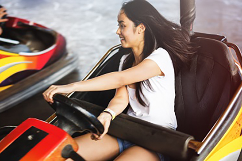 Young girl on bumper cars