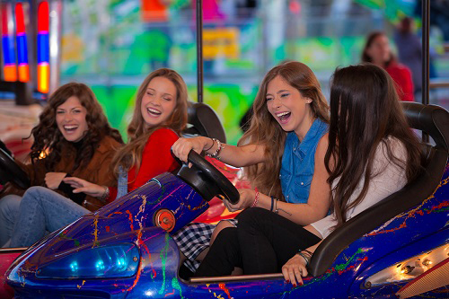 Young ladies on bumper cars