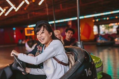 Young lady rides bumper cars